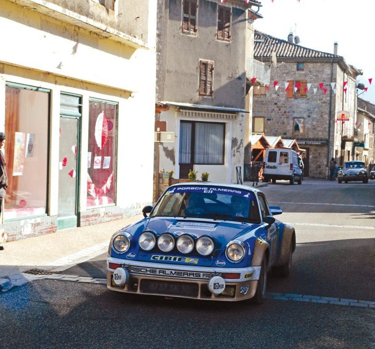 Burbling through Burzet is the Porsche 911 of Jean-Christophe and Stephane Bonoron. Photo: Peter Collins