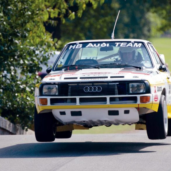 Audi Quattro rally car flies over the humpback bridge. Photo: Simon Wright