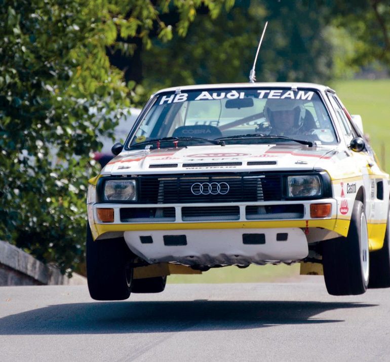 Audi Quattro rally car flies over the humpback bridge. Photo: Simon Wright