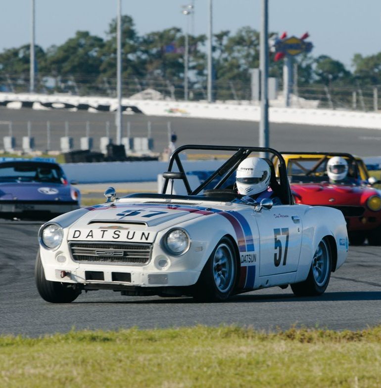 Don Herman fends off the pack chasing his ’69 Datsun 2000. Photo: Chuck Andersen