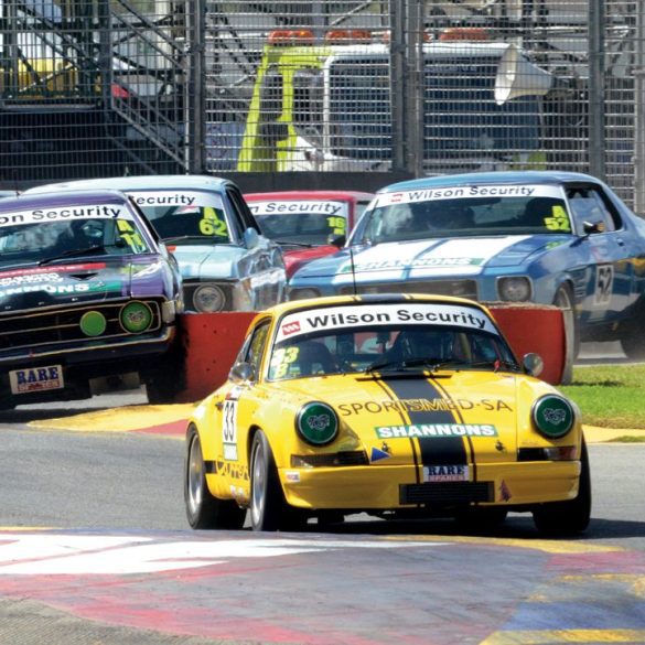 Greg Keene enjoyed a moment of glory as his Porsche 911S led the field in the reverse-grid Top 8 race for a lap before a puncture took him out. Photo: John Lemm