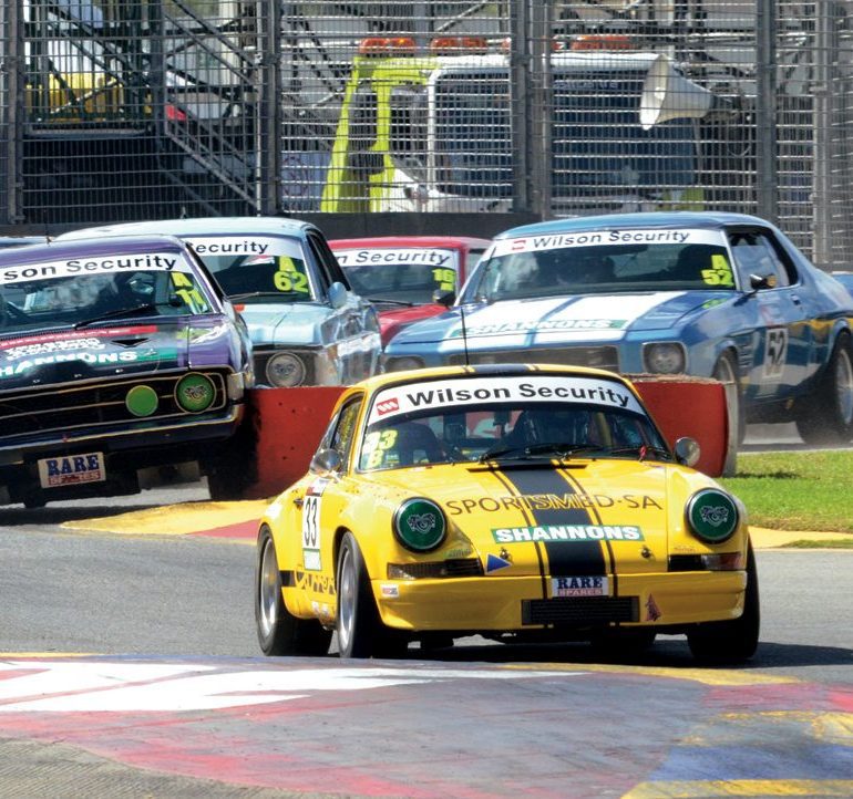 Greg Keene enjoyed a moment of glory as his Porsche 911S led the field in the reverse-grid Top 8 race for a lap before a puncture took him out. Photo: John Lemm