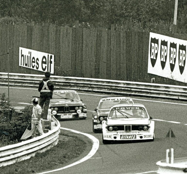 This is the lead battle blasting through Stavelot during the early hours of the 1976 Spa 24 Hours. Averaging speeds of 200 kph, a trio of BMW CSLs scream through the uphill, banked turn.