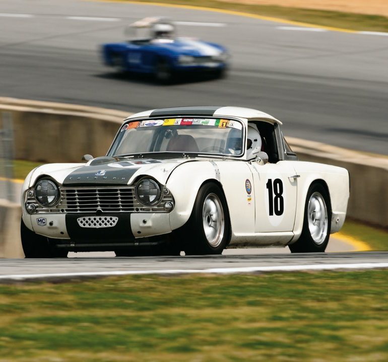 At speed in his 1964 Triumph TR4 is Dennis Delap. Photo: Michael Casey-DiPleco