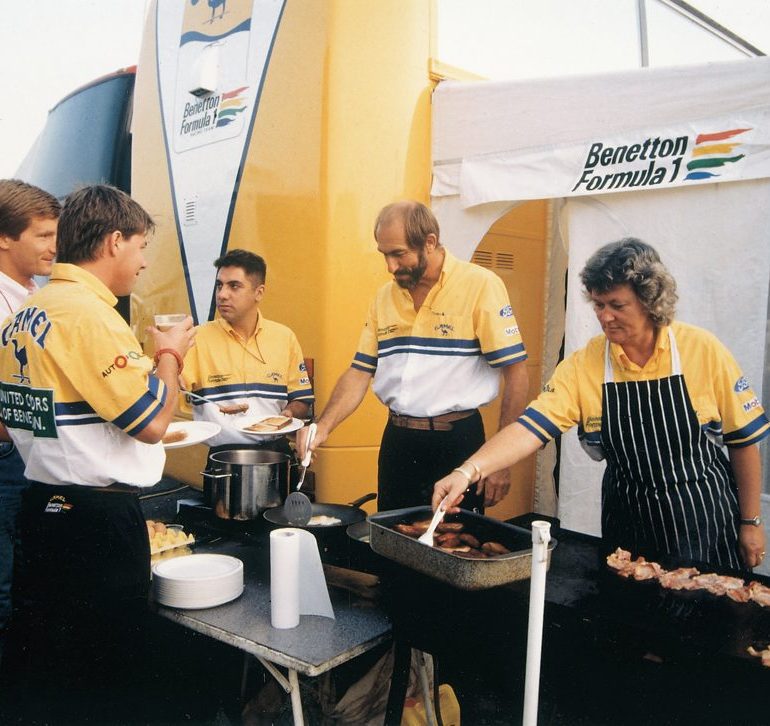 Di and Stuart Spires at work cooking up lunch for the team during their days with Benetton. Photo: Spires Collection