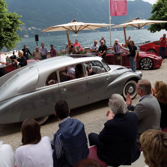 Karol Pavlu drives the distinctive 1939 Tatra 87 Sedan Aerodynamic into position next to lovely Lake Como.