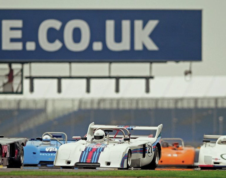 Martini Trophy start with James Dodd’s appropriately liveried Chevron B31 leading the way. Photo: Peter Collins