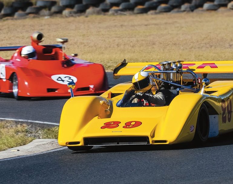 Two of the sports car stars. Duncan MacKellar’s McLaren M8E leads the pretty Osella PA5 of Ian Ross through Turn 2. Photo: Shifting Focus