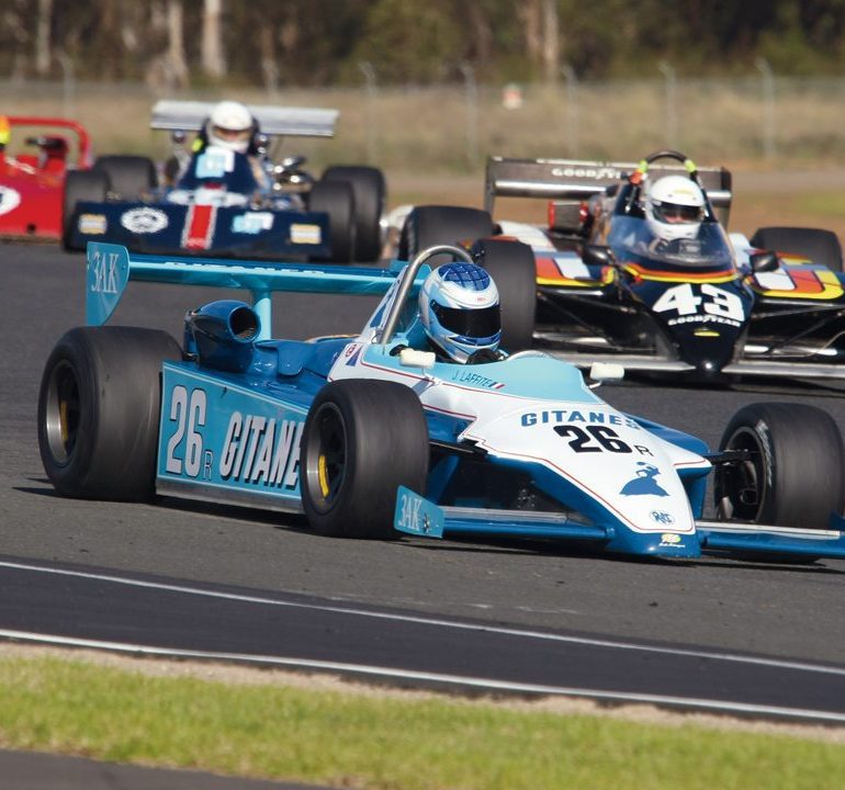 The Ralt RT4 of Geoff Calvert is chased by Ian Buddery’s Lola T700. Photo: Steve Oom