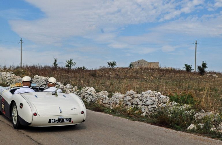 Jetze Visser and Olf Boesjes Healey 100S in typically rugged Sicilian scenery. Photo: Peter Collins