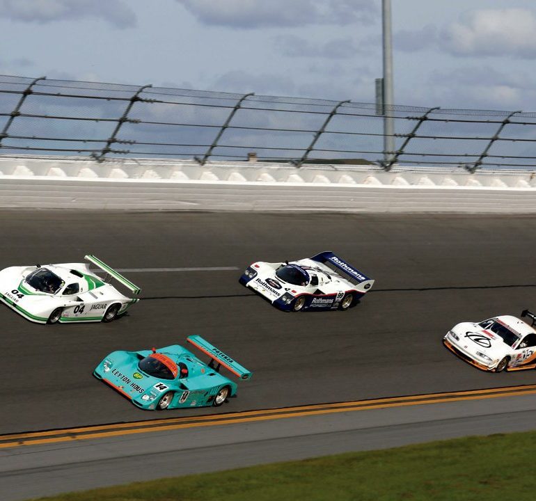 Two 962s, a Jag and an Olds Aurora on the banking. Photo: Martin Spetz