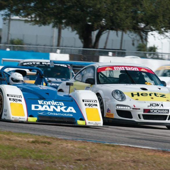 Richard Carlino takes his 1996 Riley & Scott MkIII around the outside of Jeffrey Freeman’s Porsche 997 Cup Car. Photo: Chuck Andersen