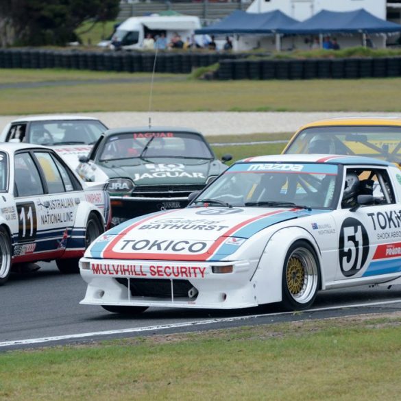 Looking a little crowded. The Mazda RX-7 of Christopher Bowden with the Holden Commodore of Jeff Trembath on the inside. Photo: Neil Hammond