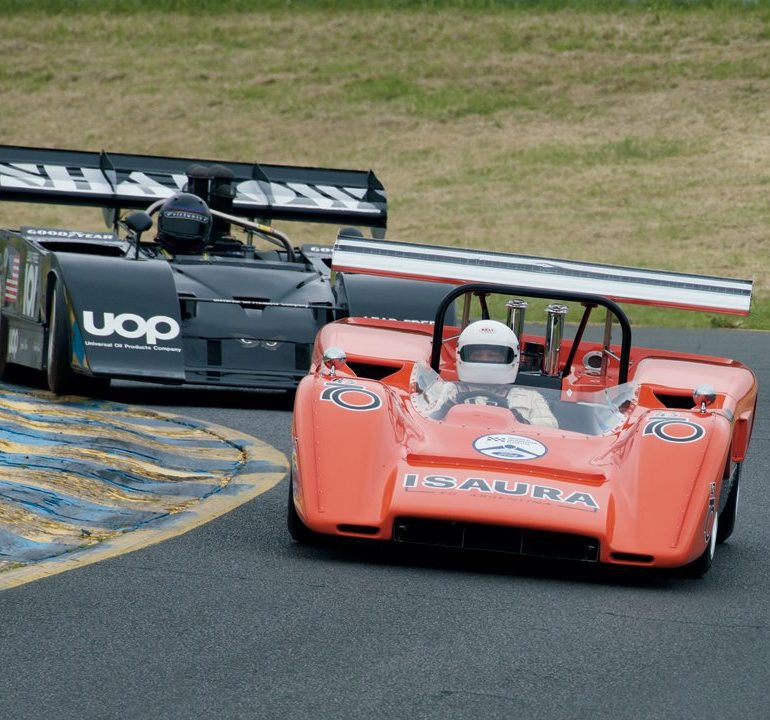 Nick Colonna (1969 McLaren M8C) fends of the attentions of Fred Cziska (1972 Shadow Mk3) in Turn Two. Photo: Dennis Gray