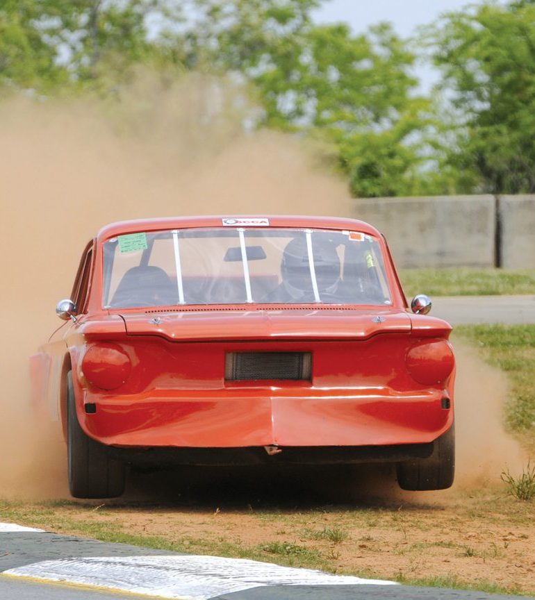 Ken Hazelton’s 1963 Corvette leads Fred Crawford’s 1974 Porsche 914-6, Scott Jachthuber’s 1972 Porsche 911, and George Tuma’s 1974 Porsche 911 RSR into Turn 5. Photo: Chuck Andersen