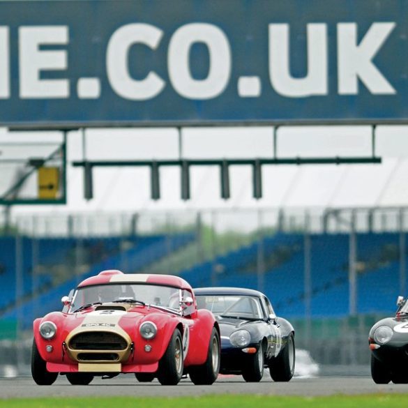 The Bryant AC Cobra heads a pair of Jaguar E-Types into Copse. Photo: Peter Collins