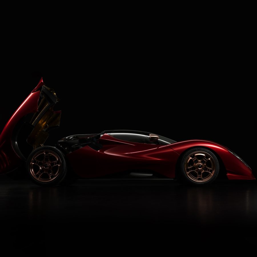 Side view of the P72 hypercar with engine door open