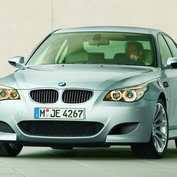 Silver 2005 BMW M5 parked in showroom