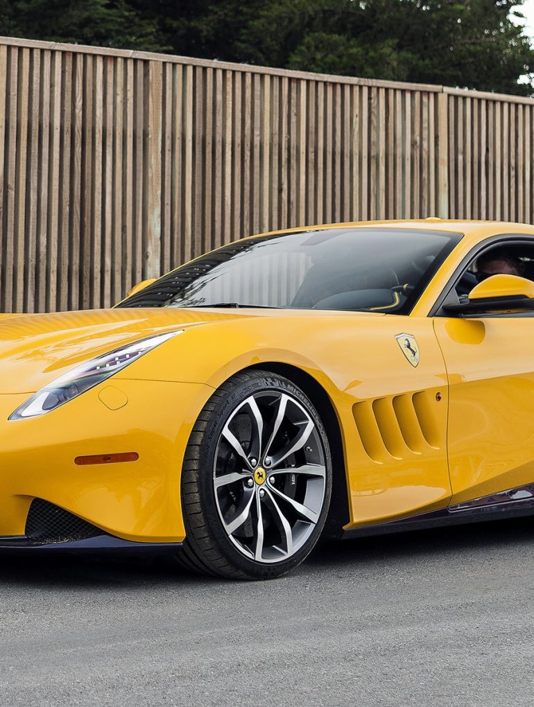 Yellow Ferrari SP 275 RW Competizione parked on road