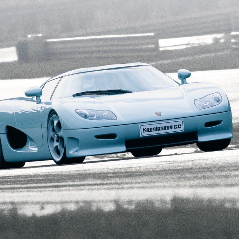 Blue Koenigsegg CC8S driving on snowy road in winter