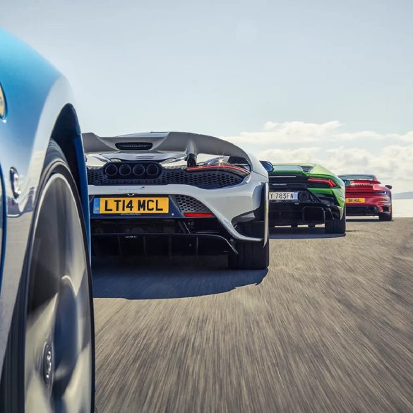 Image showing the partial rear view of some supercars.