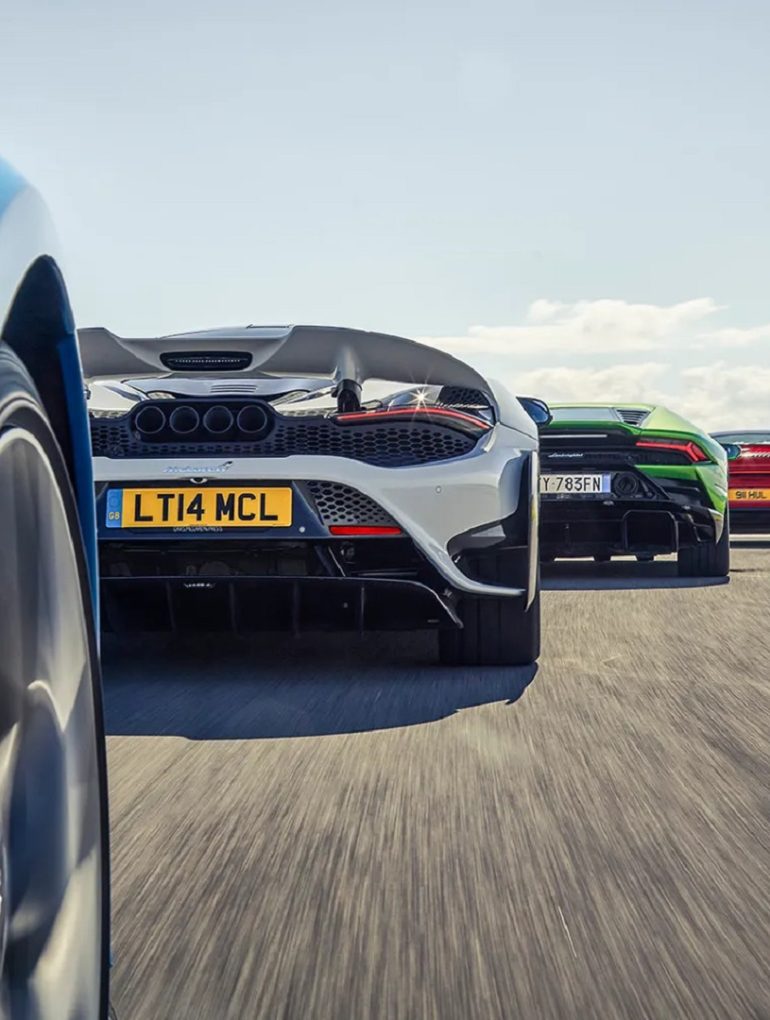 Image showing the partial rear view of some supercars.