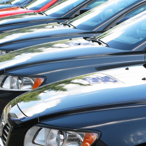 Cars parked side by side in a lot