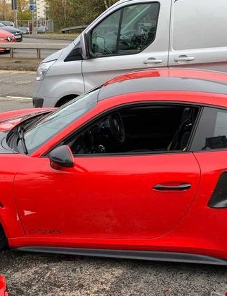 Wrecked red Porsche 911 GT2