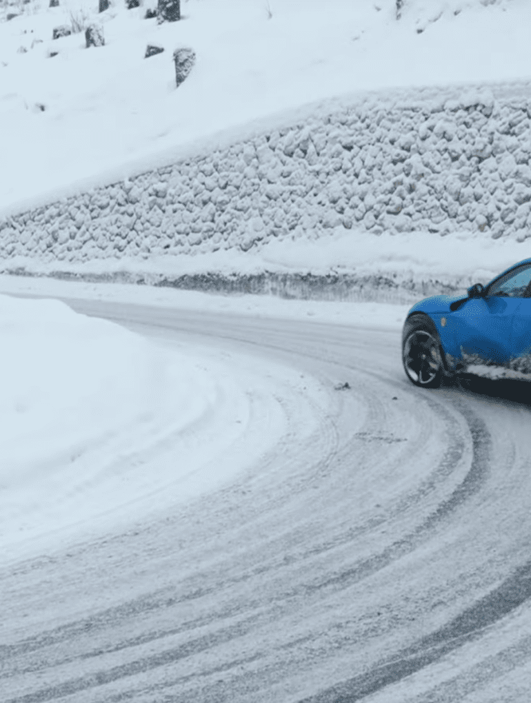 Ferrari Purosangue drifting in the Italian snow