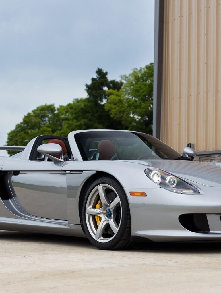 front-angled view of a silver 2005 Porsche Carrera GT.