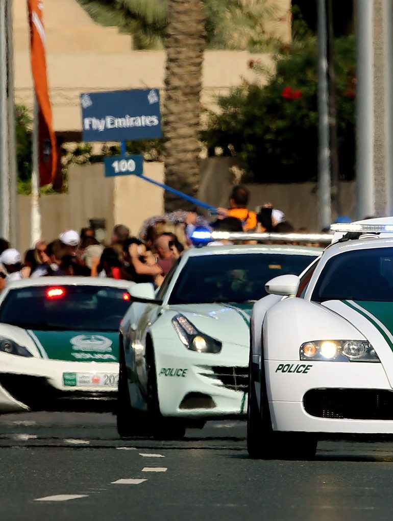 Image showing a Bugatti Veyron, Ferrari FF, McLaren MP4-12C and Bentley Continental GT - all part of the Dubai Police Force.