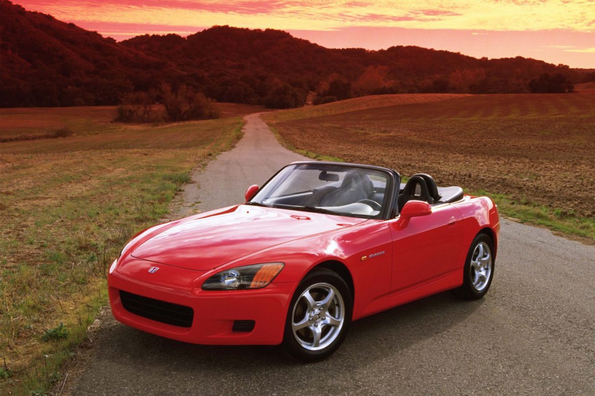 Three-quarter side view of a red Honda S2000