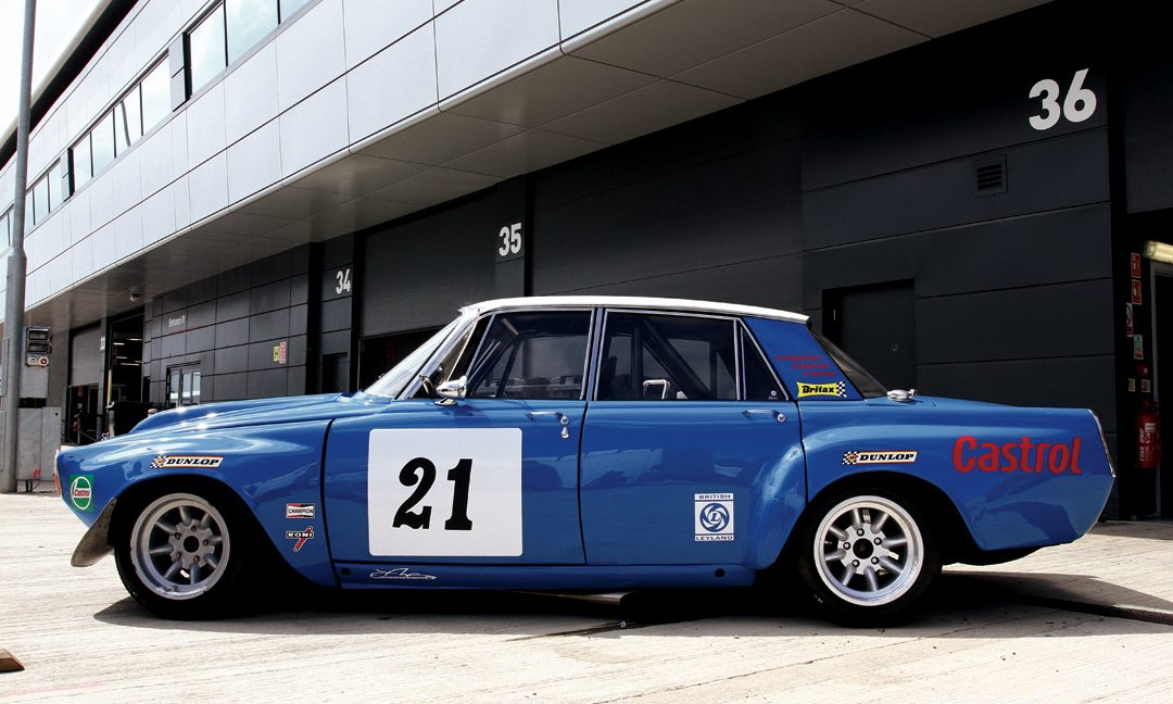 Side view shows off the lightweight four-door body’s bulging fenders and hood