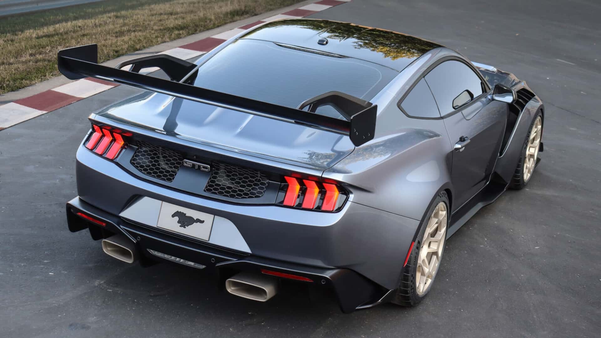 Rear-angled view showing an aerial view of a silver Ford Mustang GTD