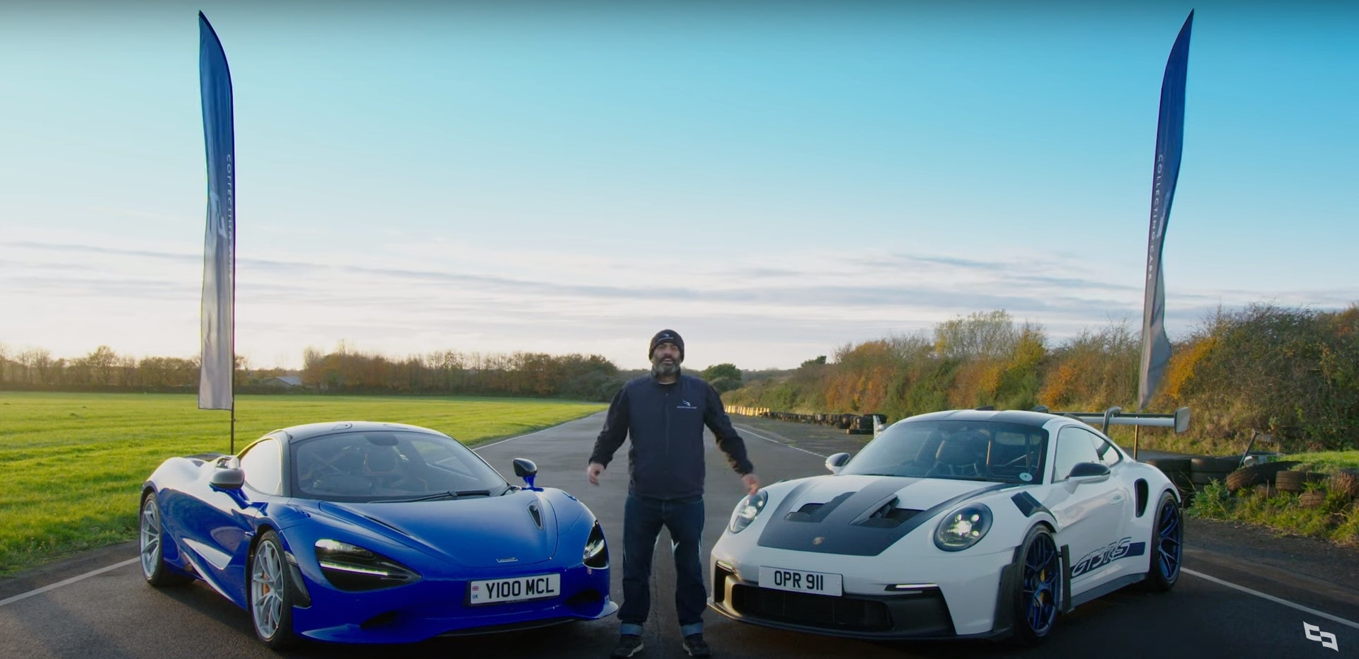 Front-angled profiles of a blue McLaren 750S and predominantly white Porsche 911 (992 gen) GT3 RS